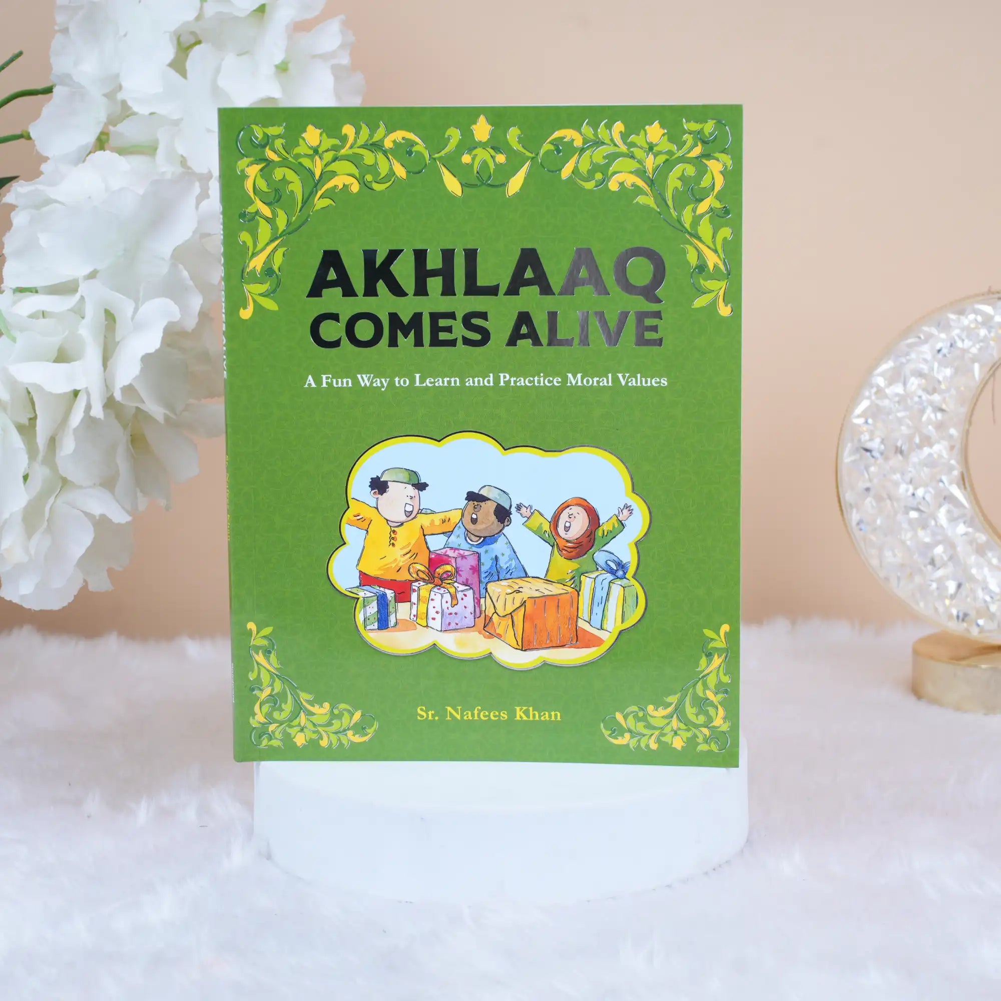 Akhlaaq Comes Alive board book cover for kids aged 5+, teaching manners and moral values with colorful illustrations and Islamic themes. Main image
