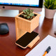 Wireless Planter Charger by Alder combines a bamboo wireless charging base with a built-in planter, perfect for eco-friendly workspace decor.
