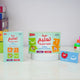 Children's Arabic learning game set on a white surface with colorful boxes in the background.