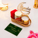 Ameen Luxe Ramadan Hamper with red tasbih box, candle, almonds, and Ramadan Mubarak greeting card in gold tray. Perfect Ramadan gift idea.