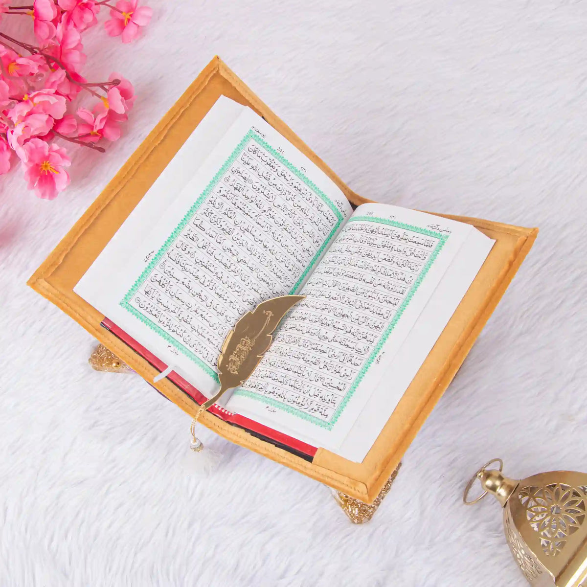 Golden Quran with green bordered Arabic script on wooden stand, part of the Golden Sawab-e-Jariya Bling Quran Gift Set for Eid and weddings.