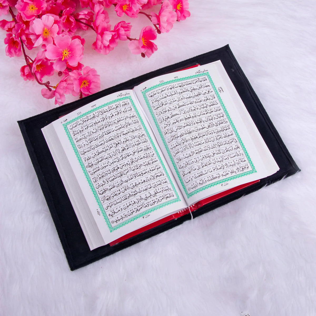 Open Quran with black velvet cover from the Black Sequence Rehal Hamper - part of a luxury Islamic gift set.