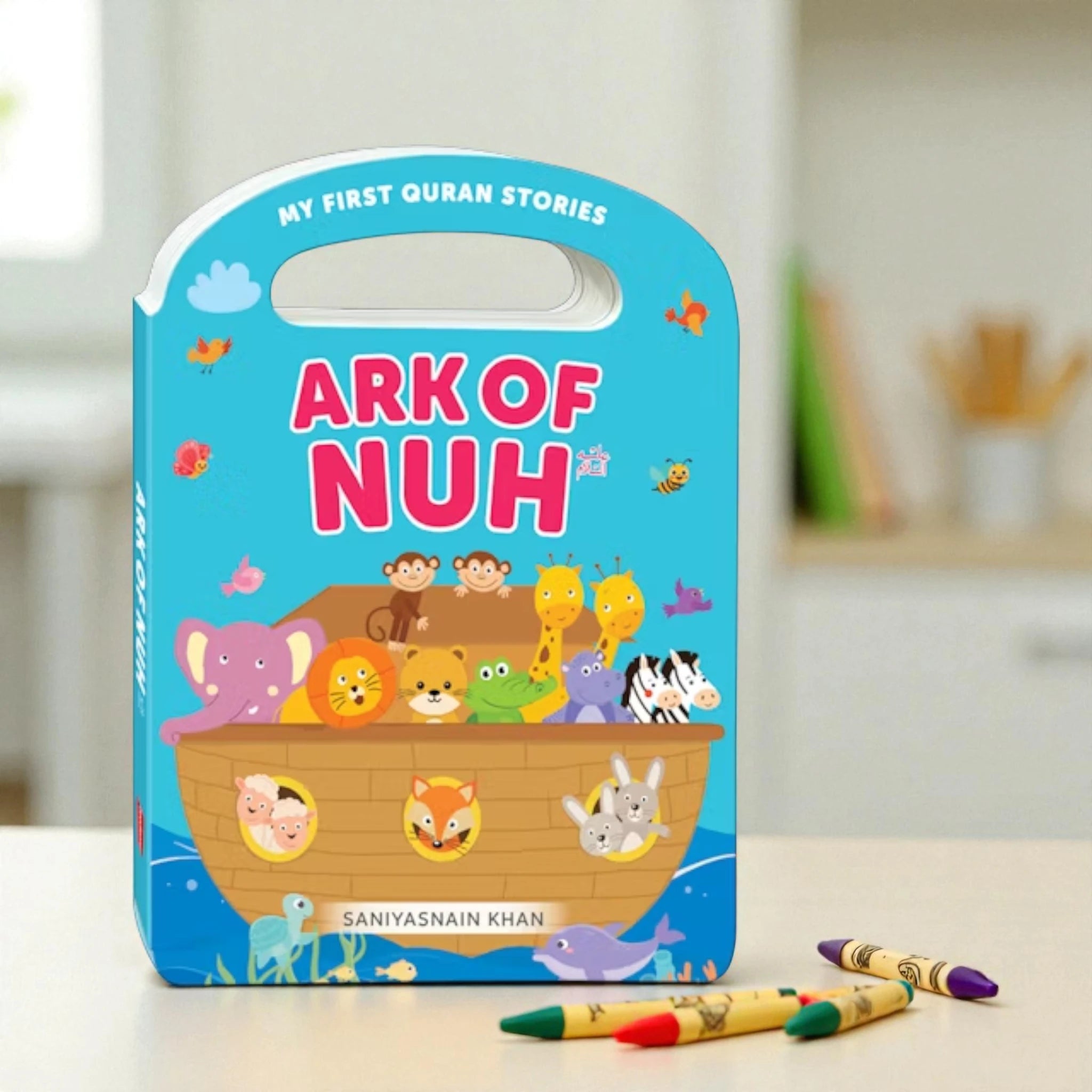 Children's book titled 'Ark of Nuh' with colorful illustrations on a table.