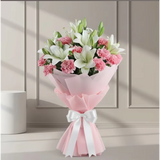 Asiatic Lilies And Carnations Flowers Bouquet arranged in packaging, close-up