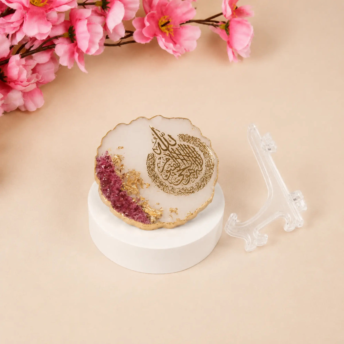 Flat-lay of 3" Ayatul Kursi Floral Frame with gold and pink floral design, shown beside its clear display stand, perfect for Islamic home decoration.