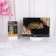 Quran book with decorative cover and pink flowers