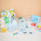 Baby Care Hamper - Baby Care set with blue animal blanket, custom babywear, grooming essentials, and toys for baby boys.