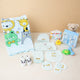 Baby Care Hamper - Baby Care gift hamper with blue animal towel, personalized baby clothes, grooming kit, and soft toys for infants.