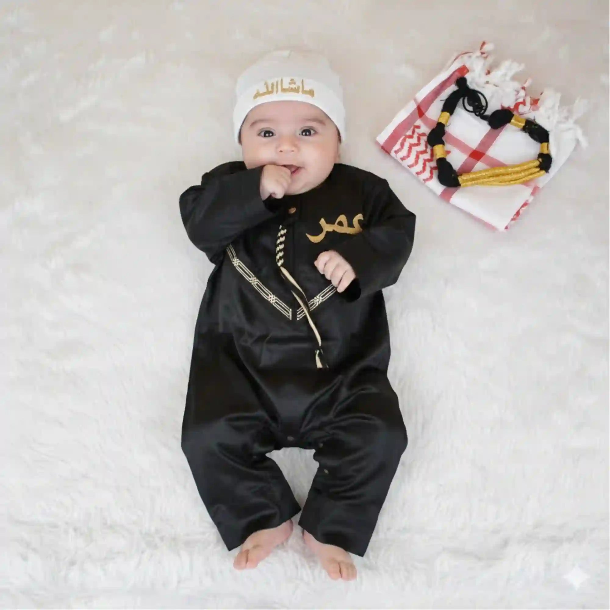 Black Omani thobe romper set for baby boys featuring gold embroidery and zipper front, ideal Islamic kids wear for Ramadan and Eid celebrations. Main image