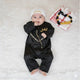 Black Omani thobe romper set for baby boys featuring gold embroidery and zipper front, ideal Islamic kids wear for Ramadan and Eid celebrations.
