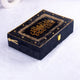 Closed view of black and gold Quran gift box with latch from the Bling Collection. Elegant storage for religious items.