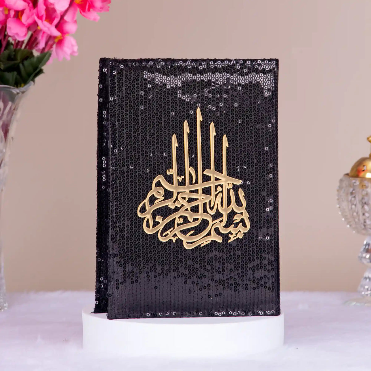 Black sequin-covered Quran with golden Arabic calligraphy from the Bling Collection Islamic Gift Set. Elegant and spiritual gift item.