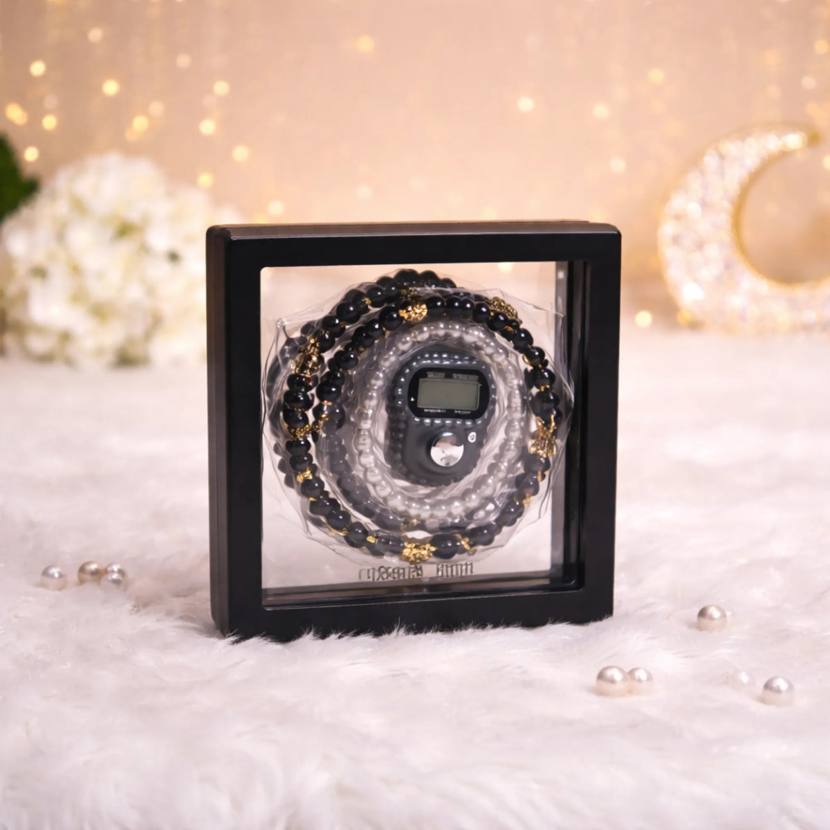 "Black Transparent Tasbeeh Combo Favor containing a 100-bead pearl tasbeeh and a matching digital counter inside a clear square PVC box."