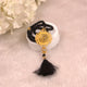 Black acrylic Tasbeeh with golden Islamic medallion and tassel from the Black Stones Rehal Hamper, perfect for daily dhikr and gifting.