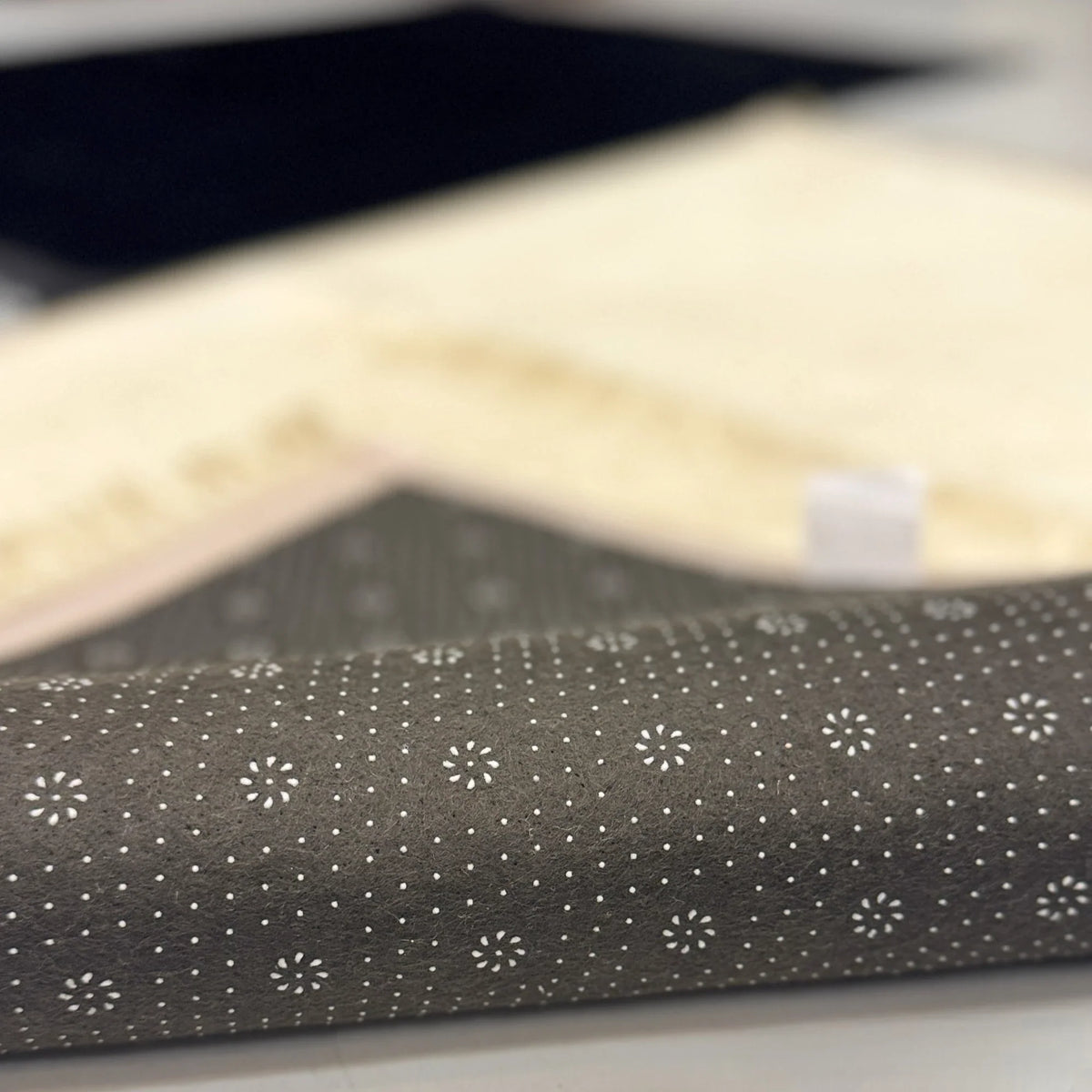 Close-up of non-slip backing on Couple Janamaz Set, soft and durable fabric ideal for daily prayers, perfect Islamic gift for couples.