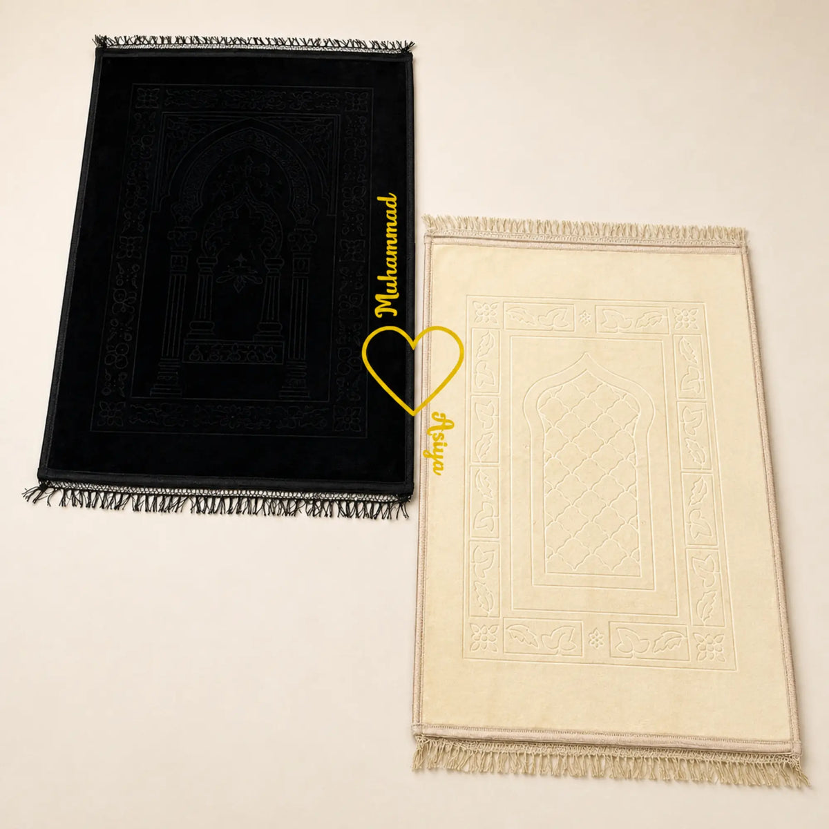 Couple Janamaz Set in black and champagne gold with heart design, soft fabric prayer mats for two, ideal Islamic wedding or bridal gift.