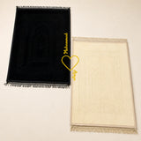 Couple Janamaz Set in black and champagne gold with heart design, soft fabric prayer mats for two, ideal Islamic wedding or bridal gift.