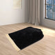 Black Dome Janamaz - Dome-Shaped Prayer Mat with premium velvet texture placed in a modern room, ideal for daily spiritual use.
