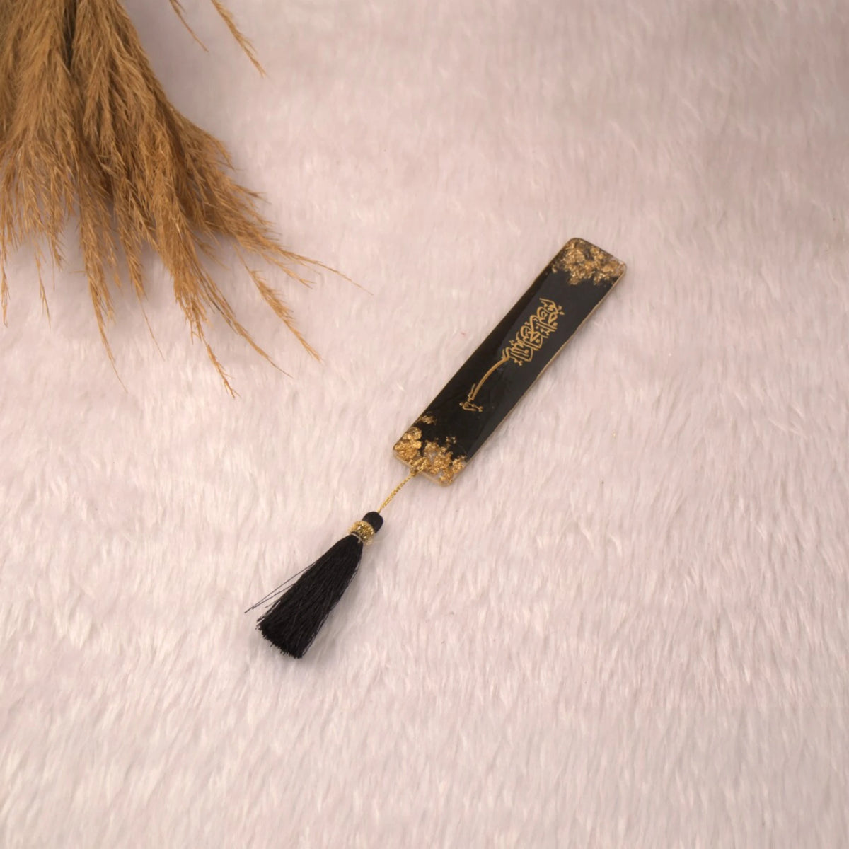 Black and gold Islamic bookmark with tassel from the Sawab-e-Jariya Bridal Gift set. Elegant accessory for Quran reading and gifting.