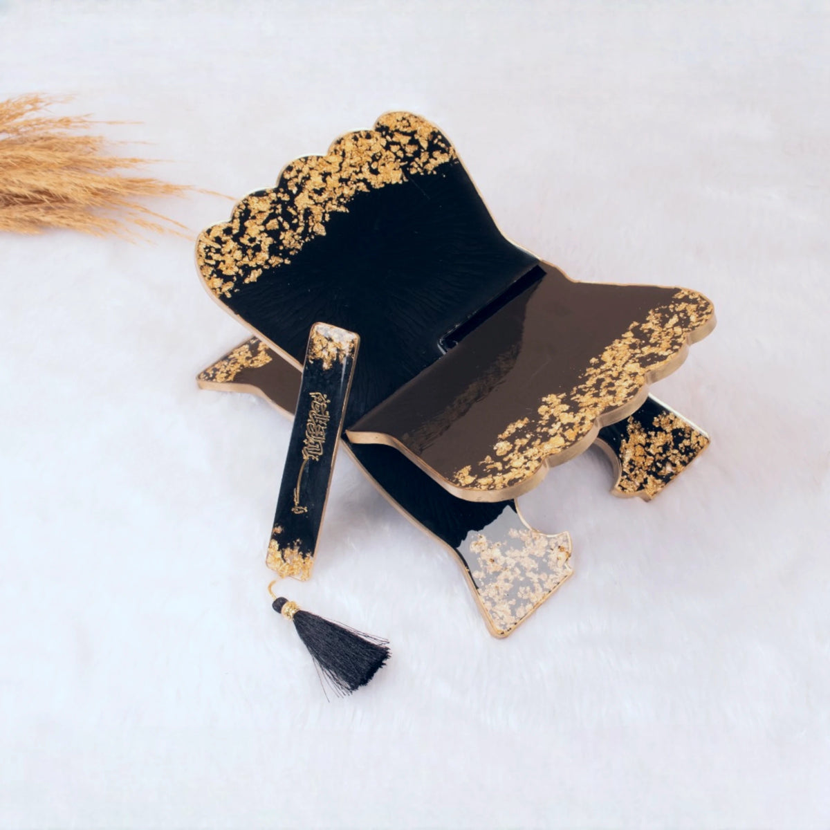 Black and gold Quran rehal with matching bookmark from the Sawab-e-Jariya Bridal Gift set. Decorative and functional Islamic gift.