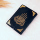 Black fabric with gold calligraphy and decorative patterns on a white background