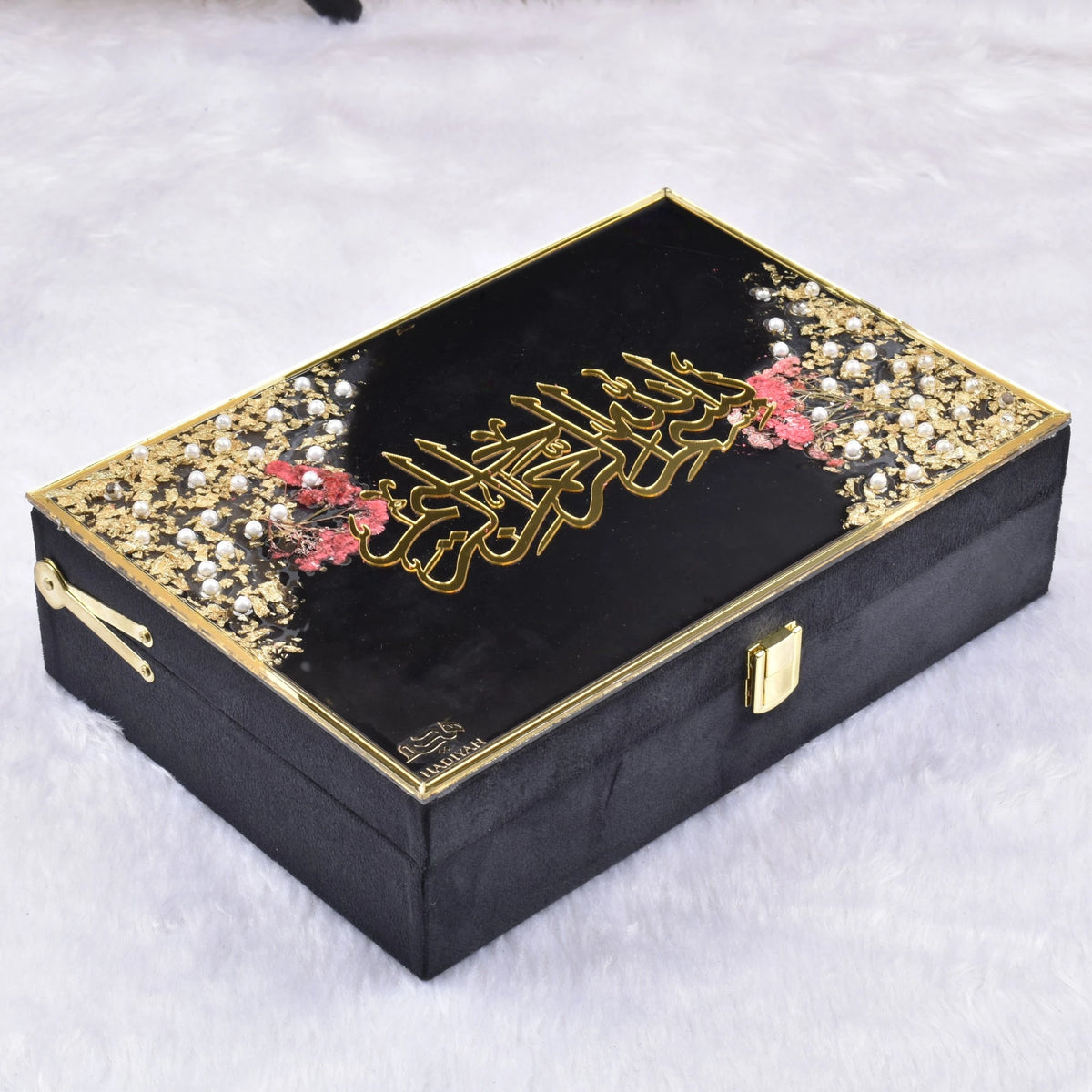 Premium black floral designer box with Arabic calligraphy, part of the Pearl Rehal Hamper. Elegant Quran gift set for Khatm-al-Quran occasions.