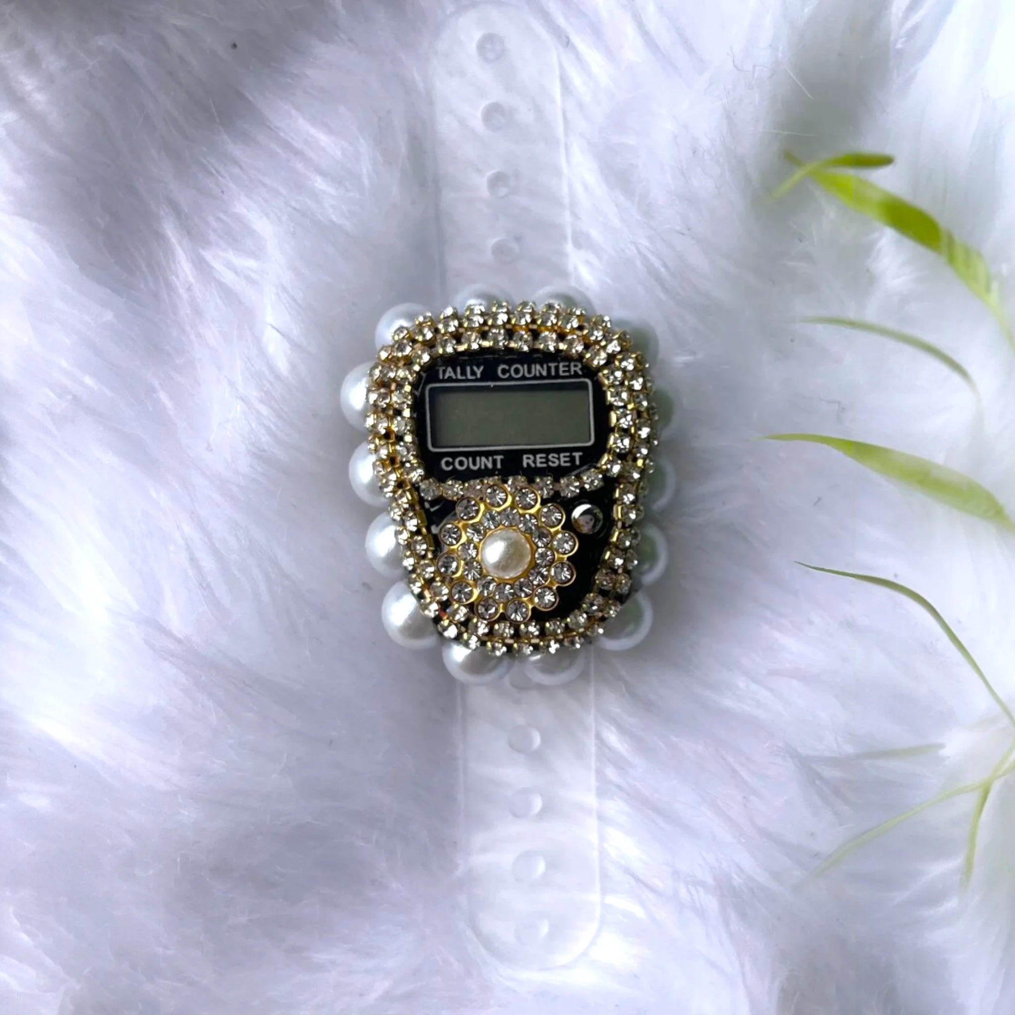 Close-up of Pearl Digital Tasbeeh in gold and white with pearl accents, a handmade digital tasbeeh counter for ceremonial use.