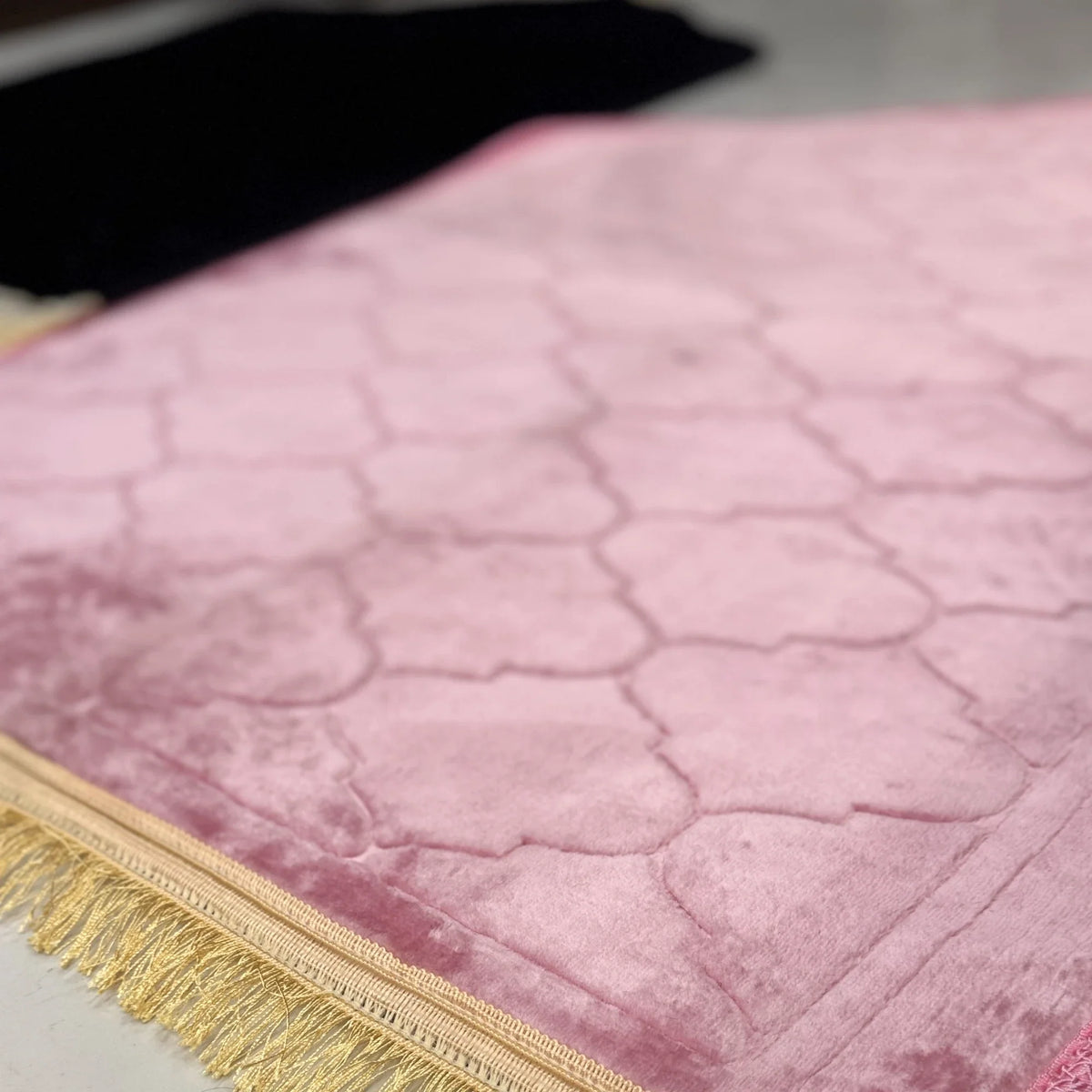 Detailed view of pink Dome Janamaz with elegant pattern and golden fringe, part of the Couple Janamaz gift set.