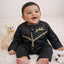 Smiling baby boy wearing Black Thobe Romper for Babies in Omani style with gold embroidery, ideal for Ramadan or Eid gifting.