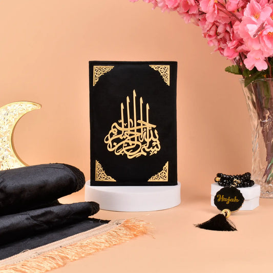 Premium Black Salah Combo Hamper featuring gold-embossed Quran, tasbeeh with name tag, and prayer mat. Ideal religious gift for men and women.