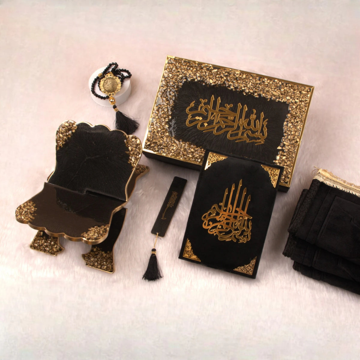 Black Stones Islamic Hamper featuring premium Quran, Rehal, Tasbeeh, and bookmark in elegant black and gold. Ideal Sawab-e-Jariya gift set.