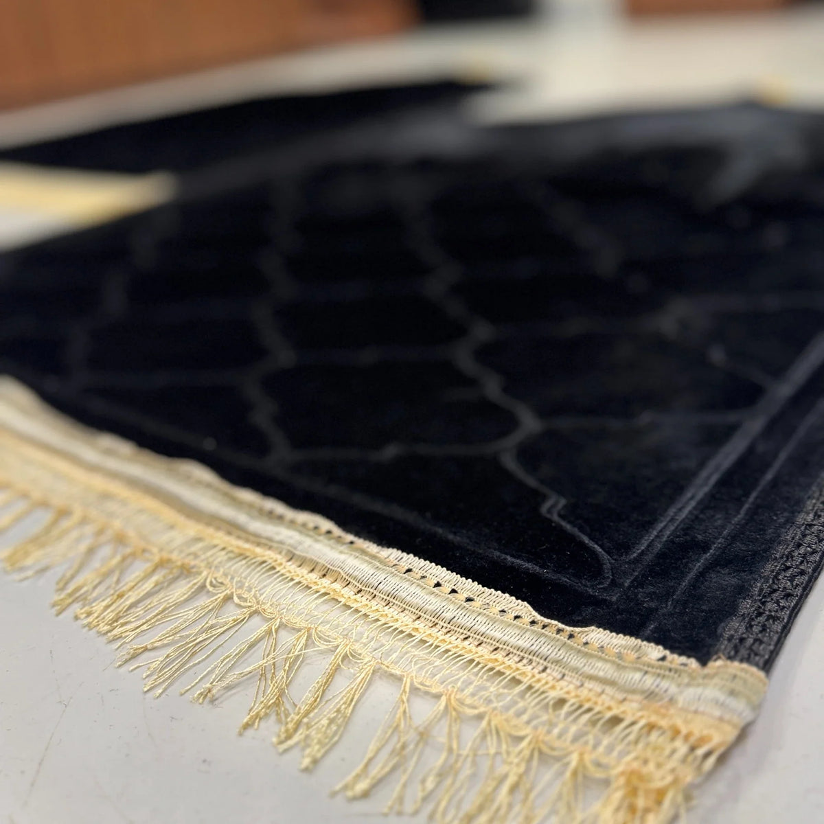 Close-up of black Dome Couple Janamaz Set - Prayer Mats showing soft velvet texture and golden tassels, perfect for bridal or religious gifting.