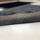 Close-up of Couple Prayer Mat Set - Black Rectangle Janamaz showing soft fabric texture and elegant heart pattern, ideal for wedding or bridal gifts.