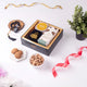 Elegant Black Velvet Islamic Hamper featuring cookies, almonds, and Tasbeeh in a premium box. Perfect for Eid, Ramadan, or milestone celebrations.