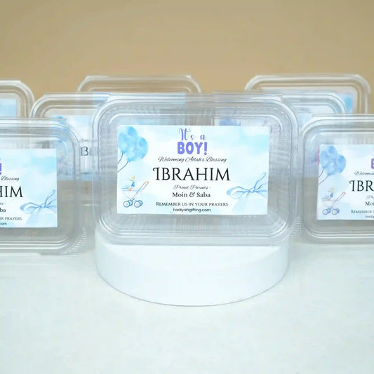 Aqiqah Meat Boxes Pack of 12 with custom name 'Ibrahim' and baby boy theme, ideal for hygienic gifting and distribution during celebrations.