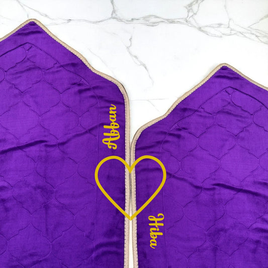 Personalized Couple Janamaz Set with names 'Affan' and 'Hiba' in yellow, dome-shaped purple prayer mats with heart detail for gifting.