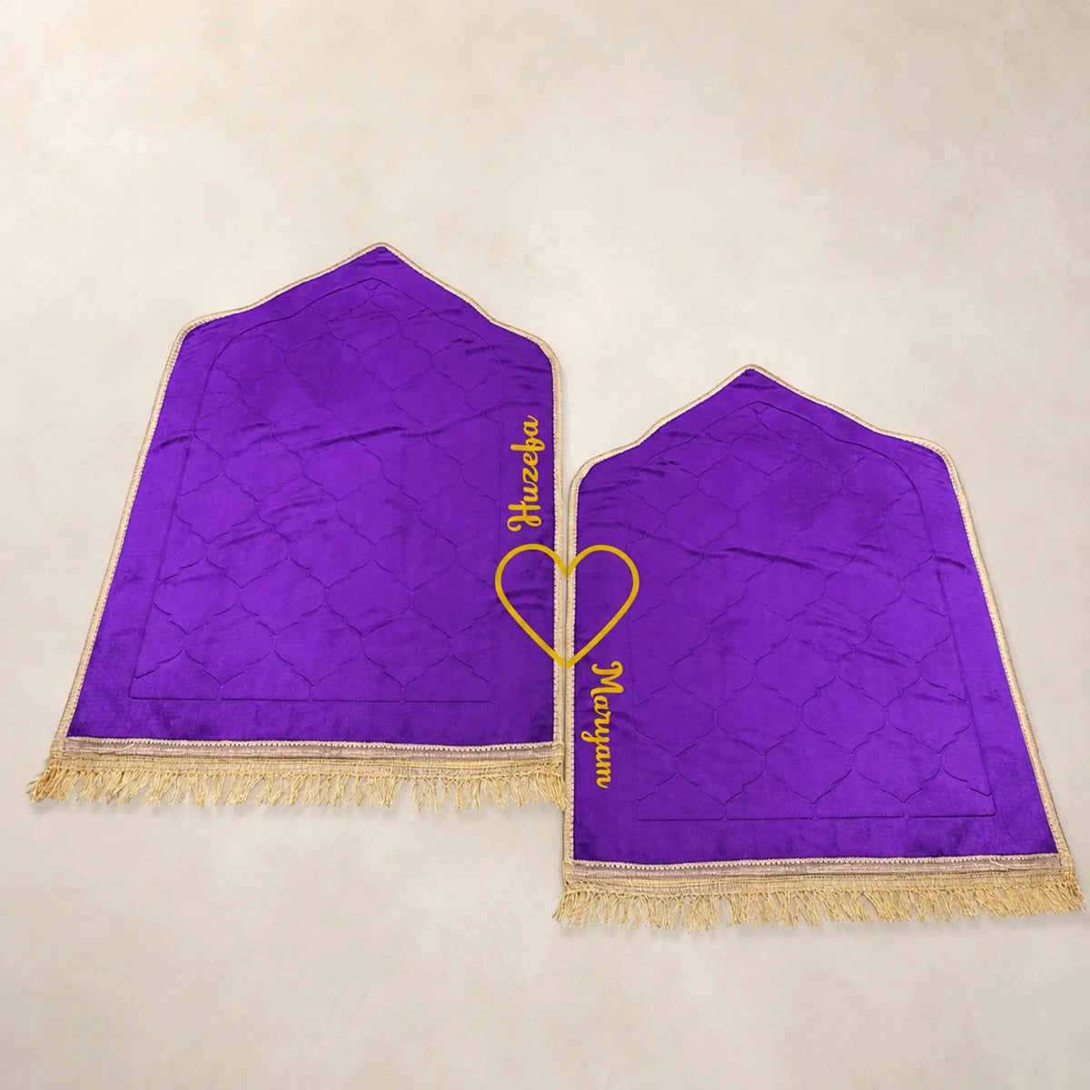 Pair of purple Janamaz with personalized names in yellow heart design. Included in the Bridal Quran Gift Set for couples.