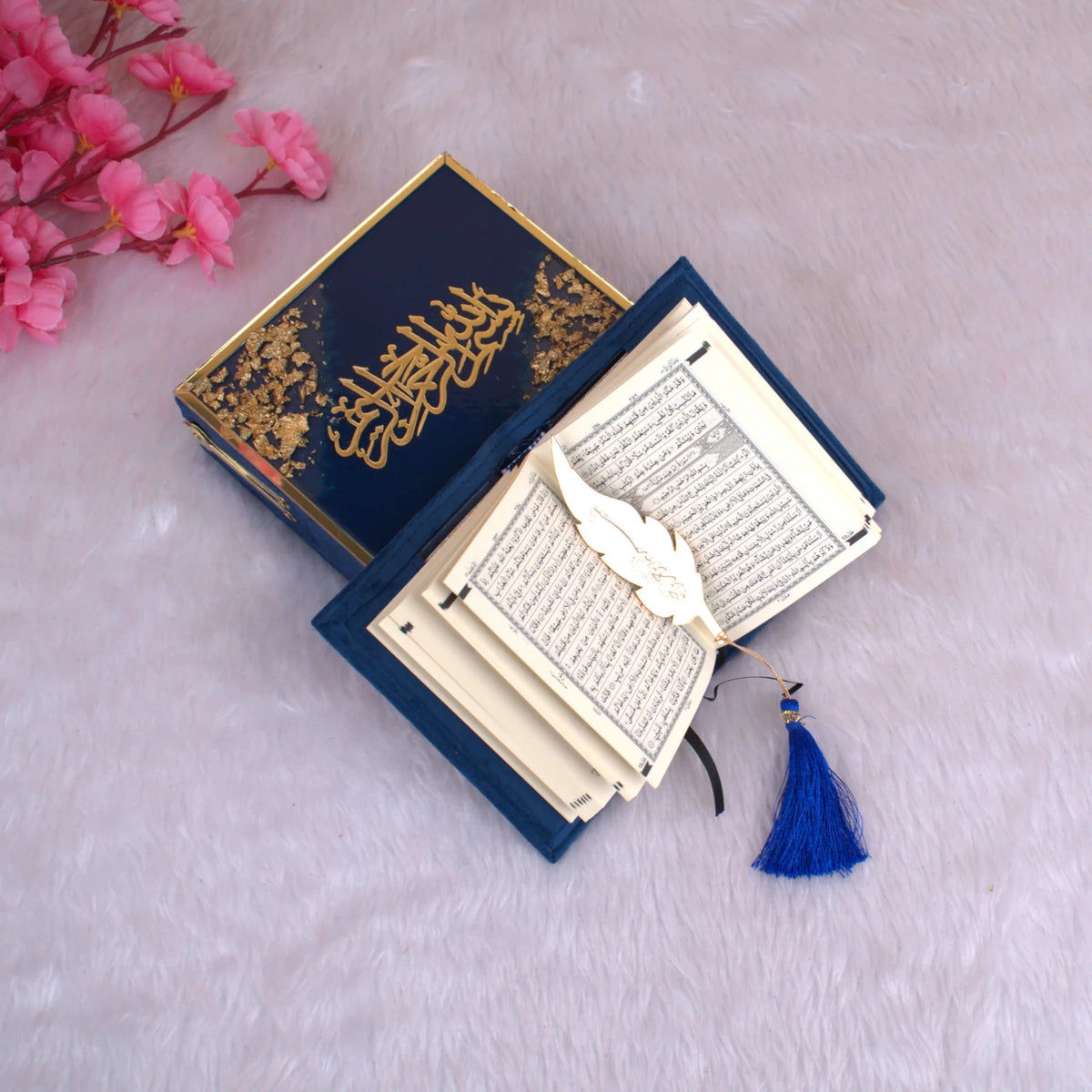 Open Mini Tilawat-e-Quran in Blue Flakes velvet cover with gold detailing, displayed with a gold feather bookmark and tassel, ideal Islamic gift set.