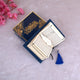 Open Mini Tilawat-e-Quran in Blue Flakes velvet cover with gold detailing, displayed with a gold feather bookmark and tassel, ideal Islamic gift set.
