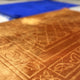 Close-up of golden prayer mat from Rectangle Couple Janamaz set showing soft velvet texture and intricate Islamic patterns.