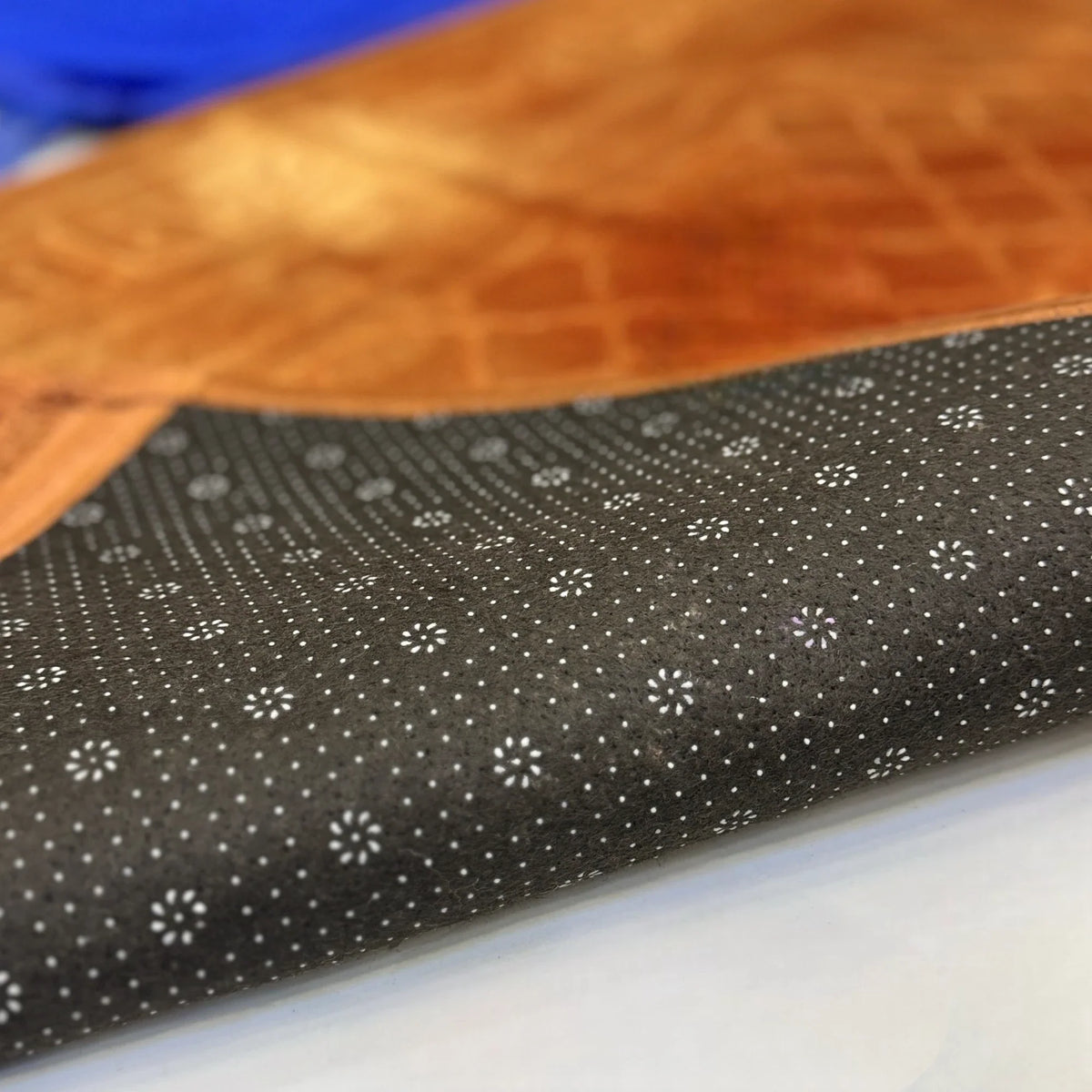 Non-slip backing of golden prayer mat from Rectangle Couple Janamaz set, ensuring comfort and stability during prayer.