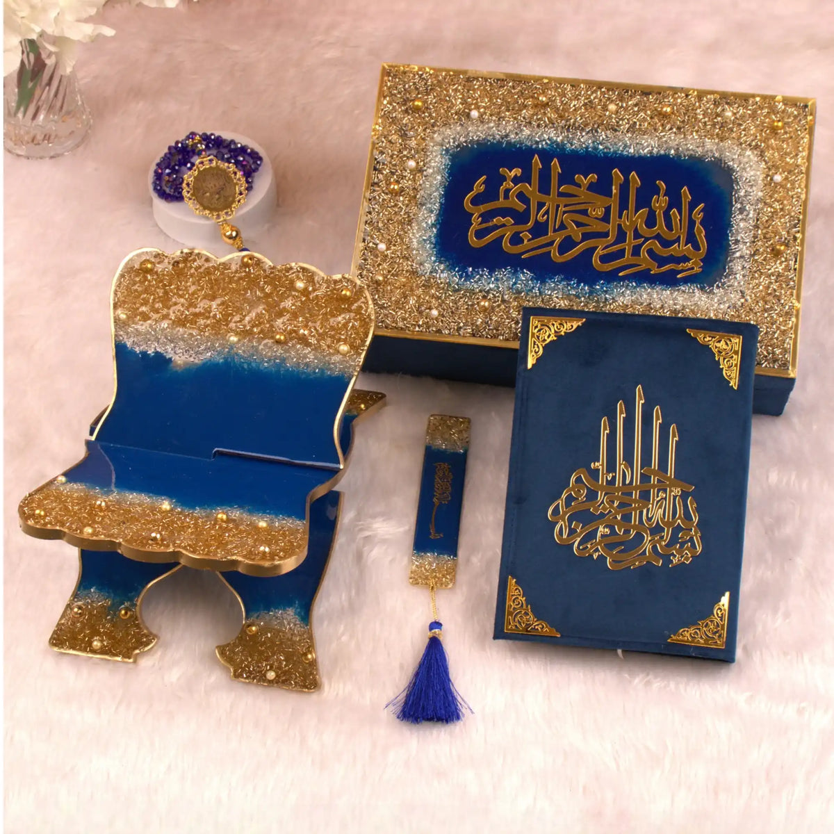 Decorative set with blue and gold elements on a light pink background