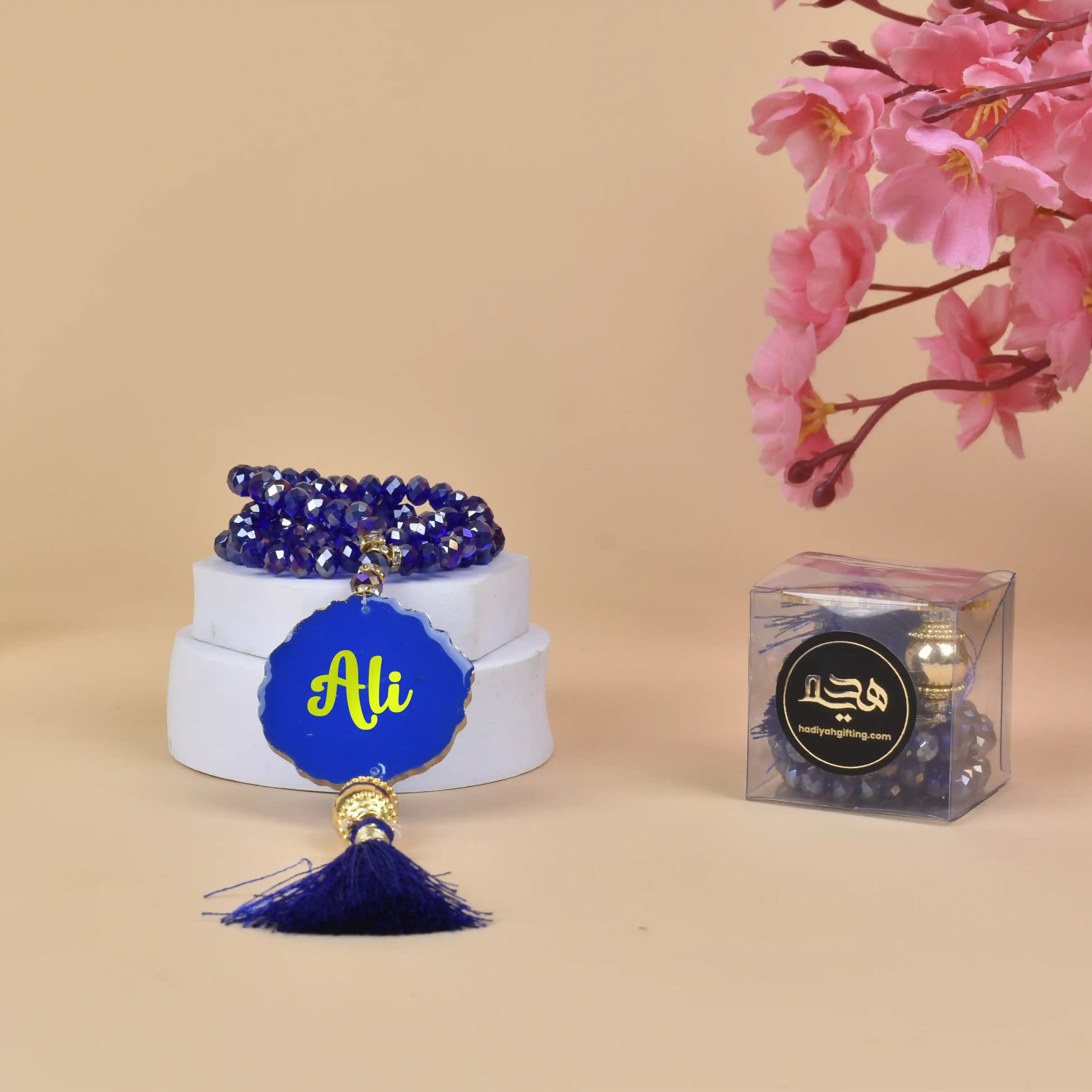 Blue Crystal Tasbeeh 100 Beads - Personalized Gift with name 'Ali', featuring deep blue beads and tassel, ideal for Ramadan and Eid gifting. Main image