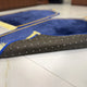Close-up of non-slip backing on blue Couple Janamaz Set, ensuring comfort and safety during prayer, perfect for bridal or wedding gifts.