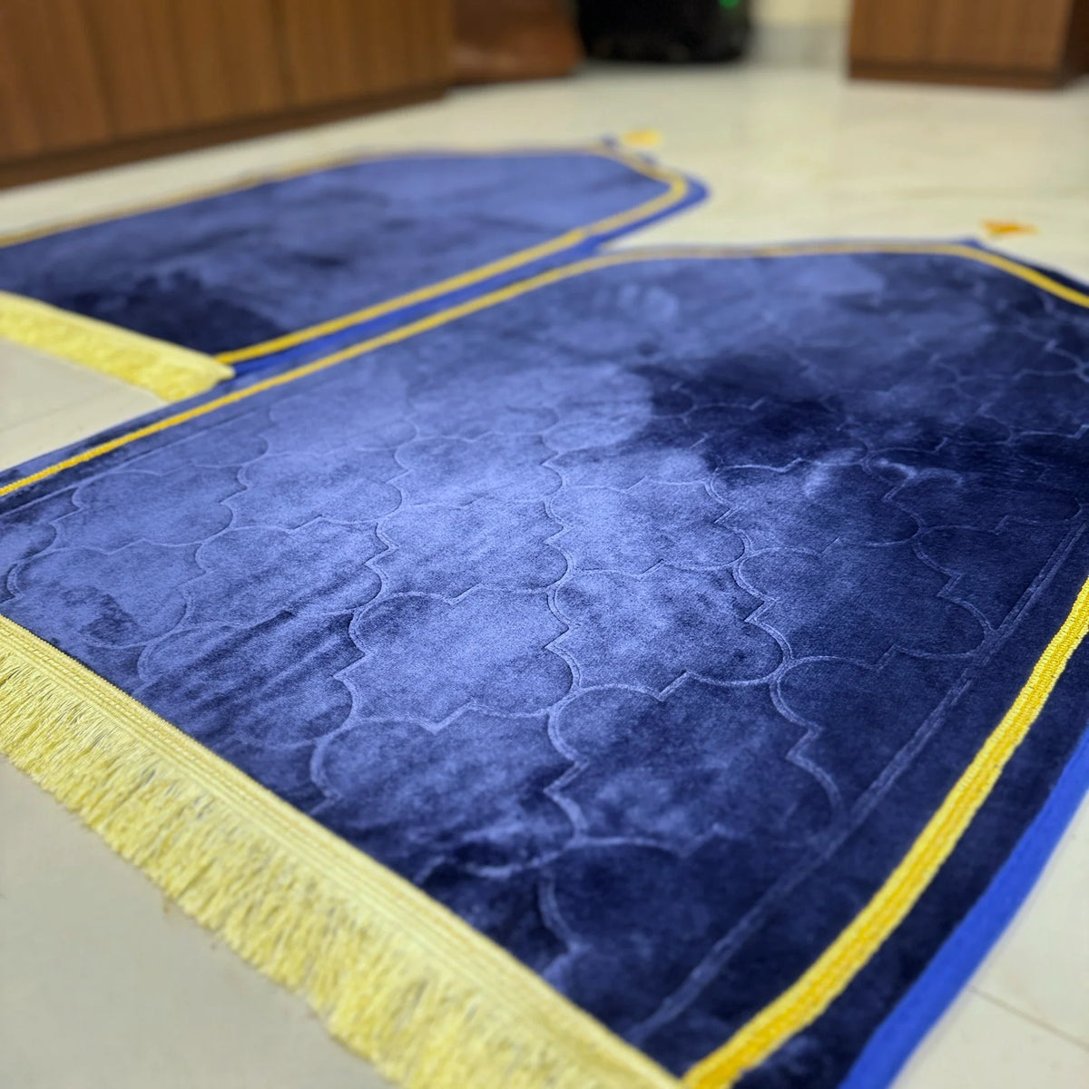Soft velvet dome-shaped Couple Janamaz Set in deep blue with golden fringe, ideal for prayer and Islamic ceremonial gifting.