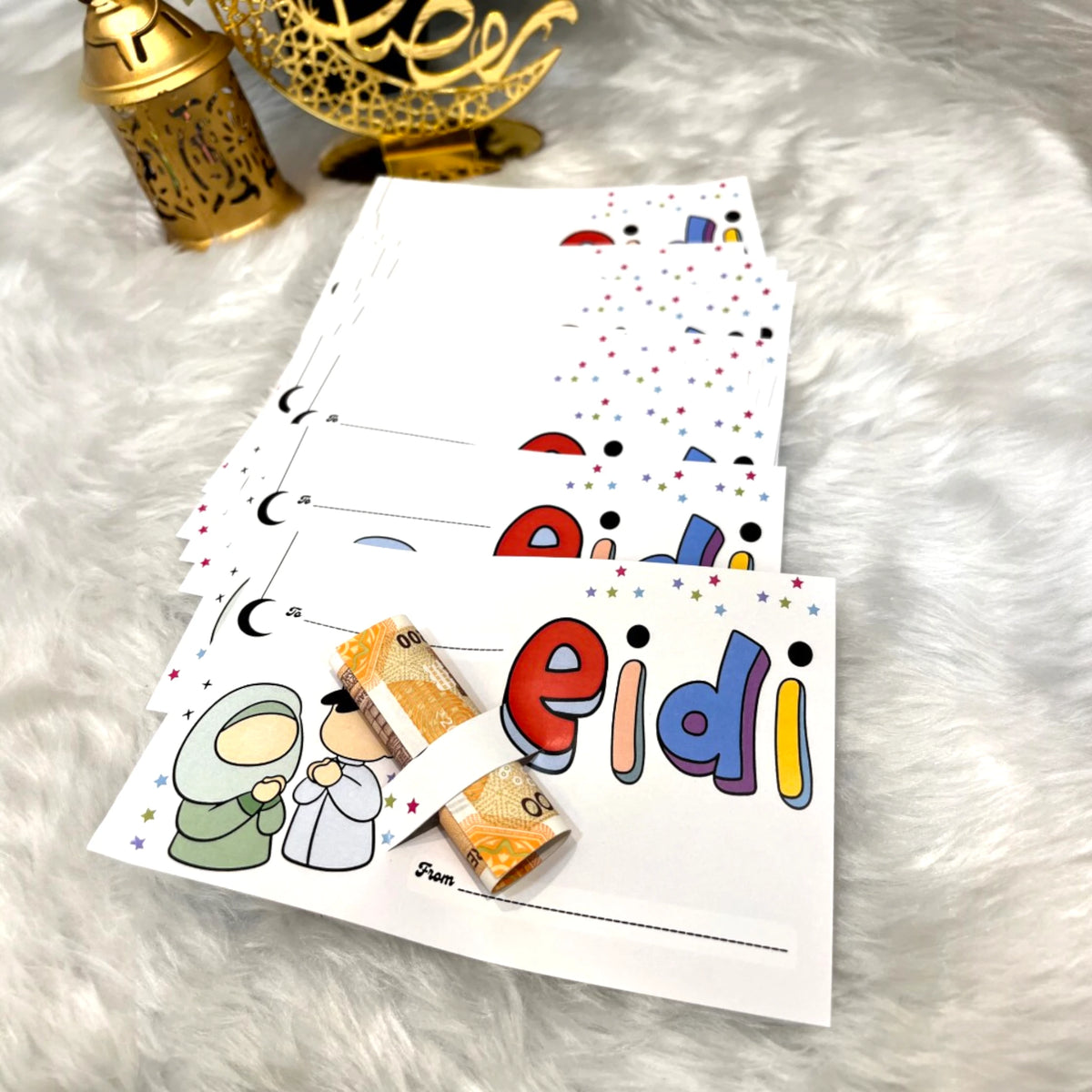 EIDI Cards Pack of 10 - Eidi Gifting Cards | Joyful Eid with cartoon kids and bold 'eidi' text, includes money holder for festive gifting.