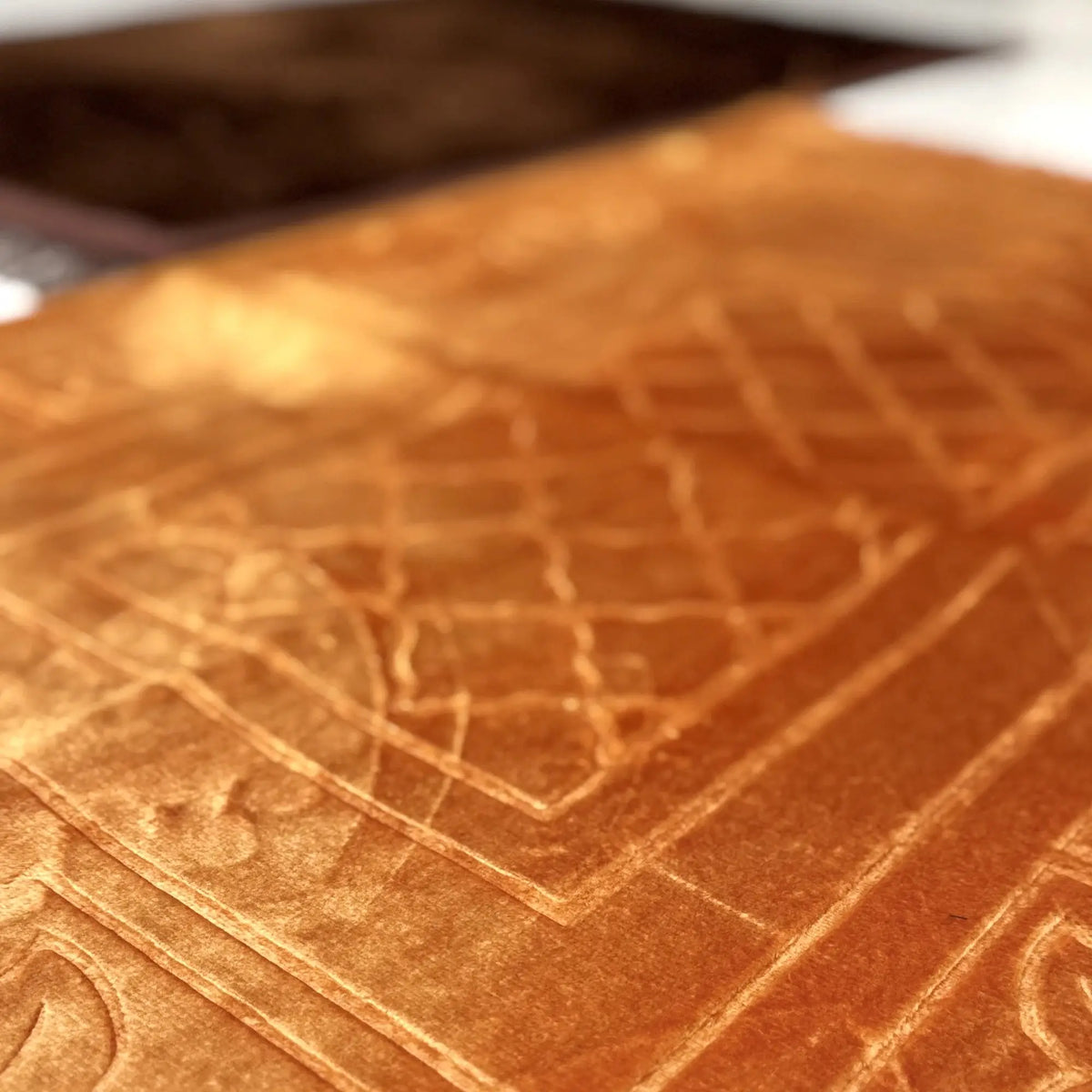 Close-up of golden prayer mat from Couple Janamaz set, showcasing plush velvet texture and intricate Islamic design for serene prayer experience.