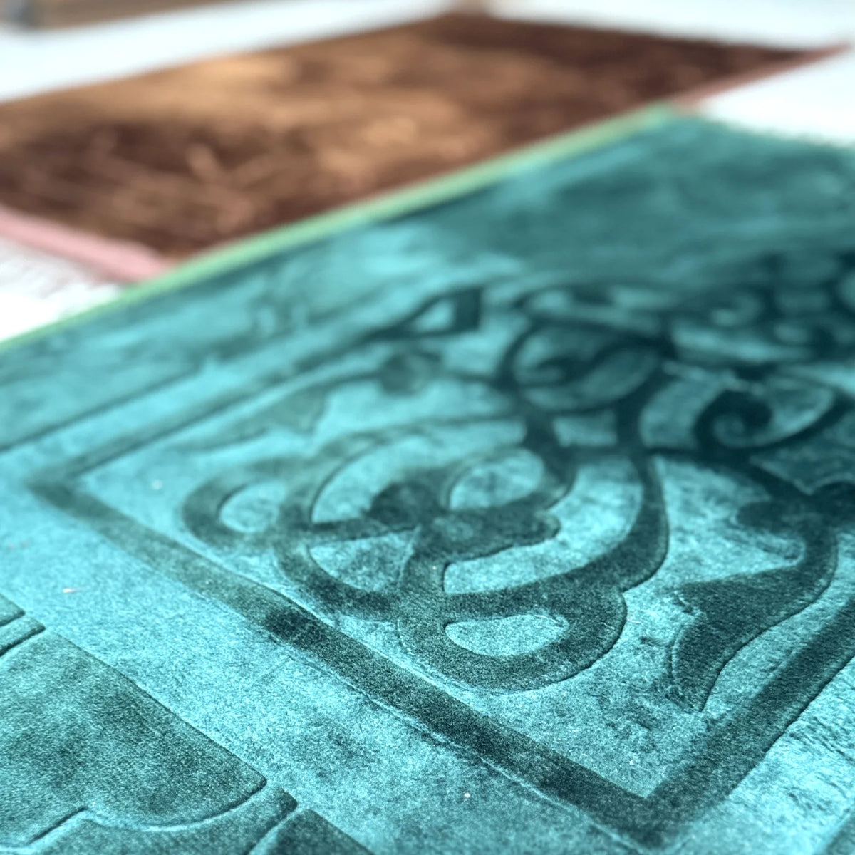 Close-up of Brown & Green Rectangle Janamaz - Couple Prayer Mats Set showing soft velvet texture and intricate Islamic patterns.