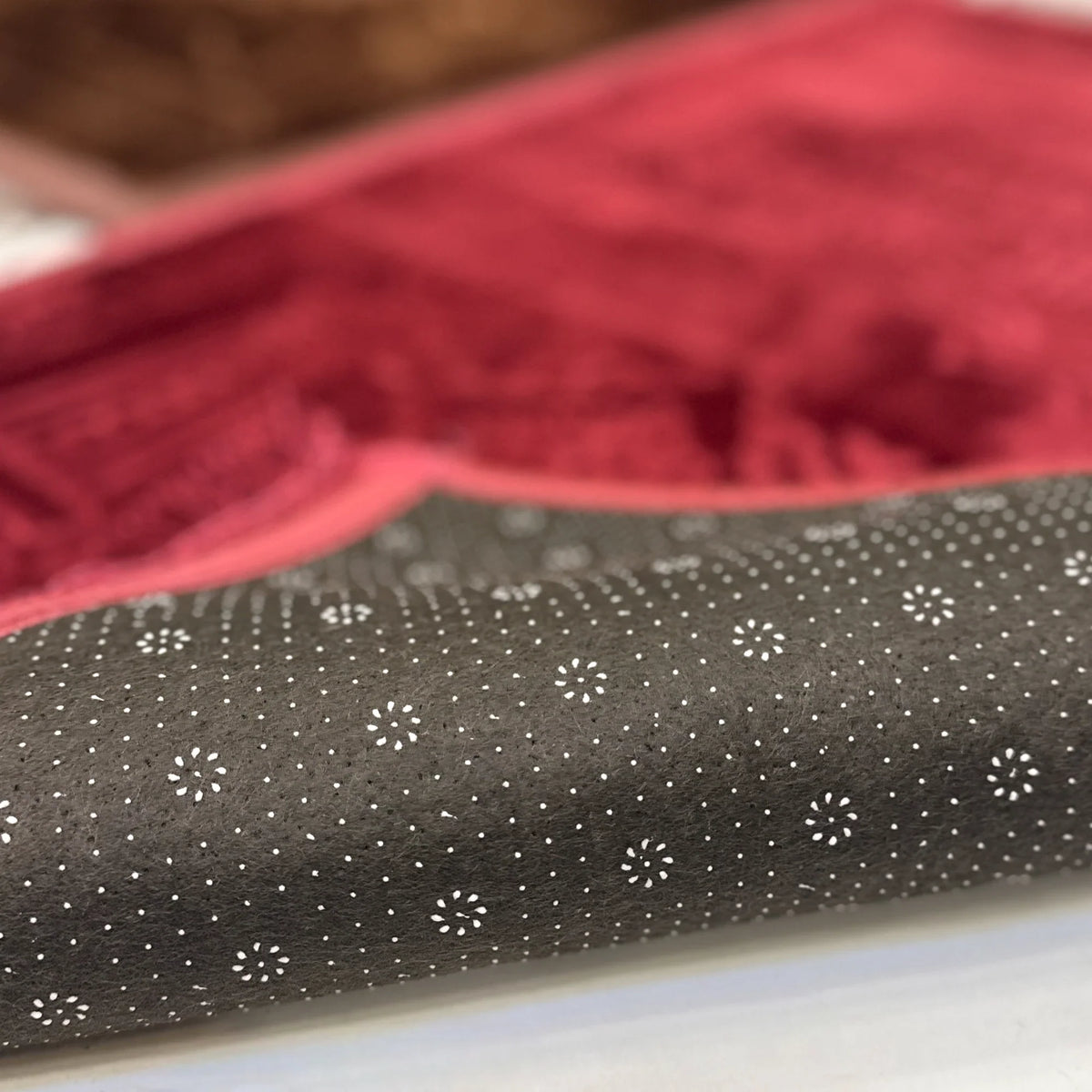 Non-slip dotted backing of the Brown & Maroon Couple Janamaz Set, ensuring safety and comfort during prayer on smooth surfaces.