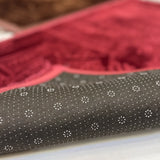 Non-slip dotted backing of the Brown & Maroon Couple Janamaz Set, ensuring safety and comfort during prayer on smooth surfaces.